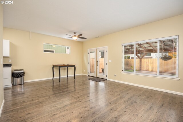 interior space featuring ceiling fan, french doors, and hardwood / wood-style flooring