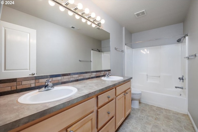 full bathroom featuring backsplash, vanity, tub / shower combination, and toilet