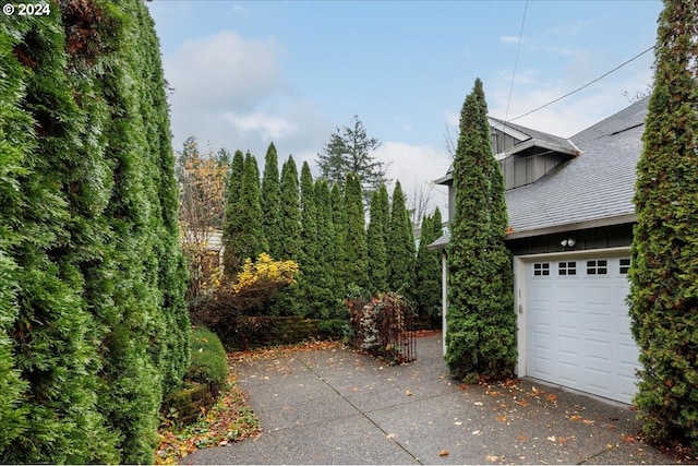 view of side of property with a garage