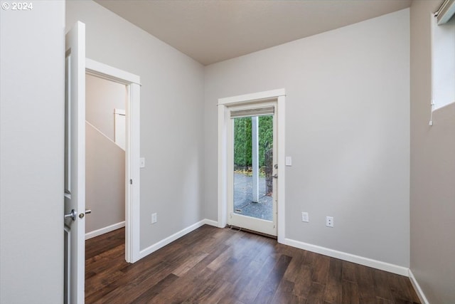 doorway with dark hardwood / wood-style floors