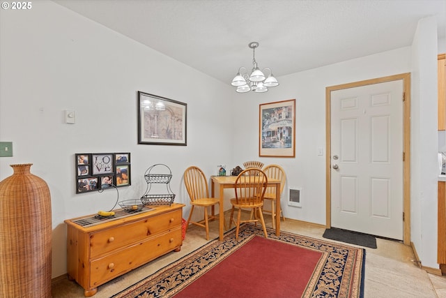 foyer featuring a chandelier