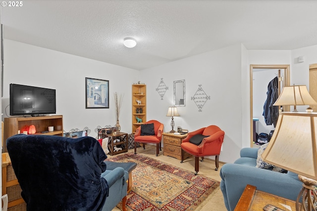 living room with light carpet and a textured ceiling