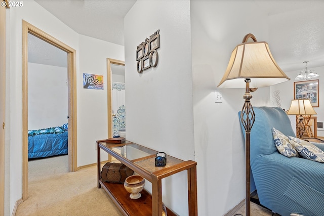 corridor with light colored carpet