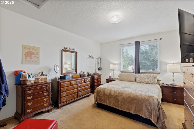 carpeted bedroom with a textured ceiling