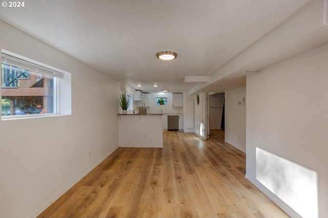 unfurnished living room with light wood-style flooring