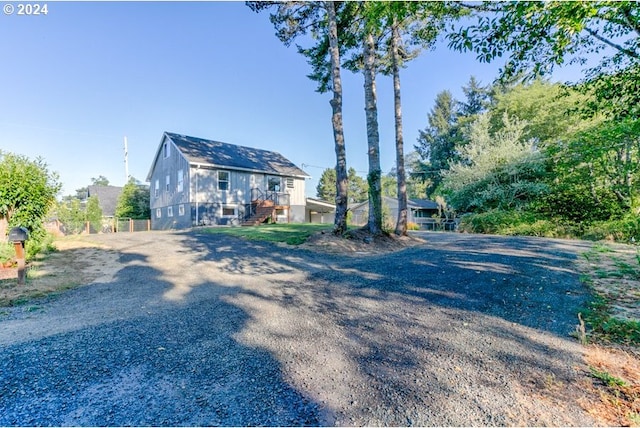 exterior space with gravel driveway