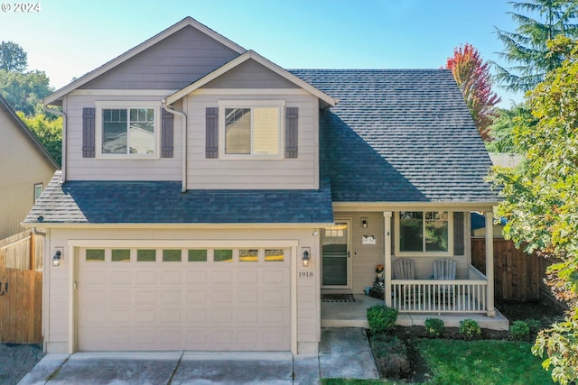 view of front of home with a porch and a garage