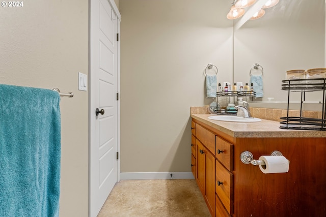 bathroom with vanity and concrete flooring