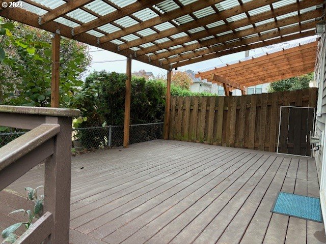 wooden terrace with a pergola