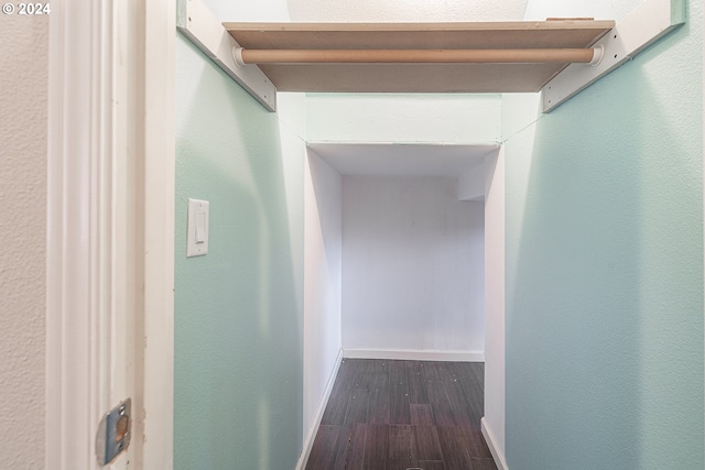 corridor featuring dark hardwood / wood-style flooring