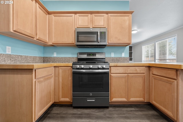 kitchen featuring light brown cabinetry, gas stove, dark hardwood / wood-style floors, and crown molding