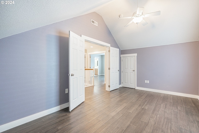 bonus room with wood-type flooring, ceiling fan, and lofted ceiling