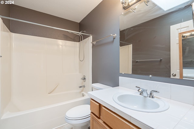 full bathroom featuring shower / washtub combination, vanity, and toilet