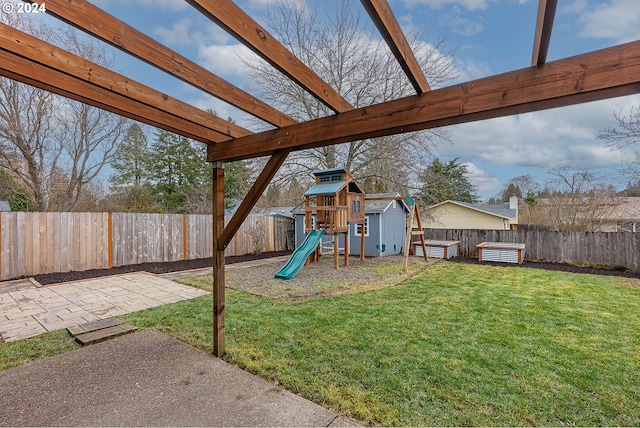 view of yard with a playground and a patio area