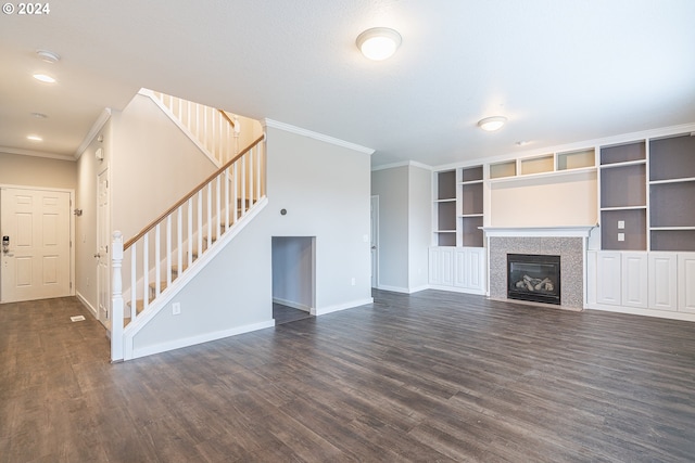 unfurnished living room featuring dark hardwood / wood-style floors and ornamental molding