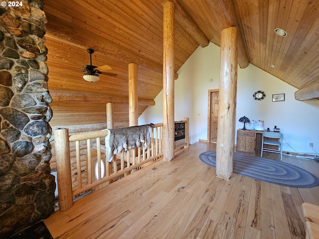 interior space featuring wood ceiling, high vaulted ceiling, beamed ceiling, and light hardwood / wood-style flooring