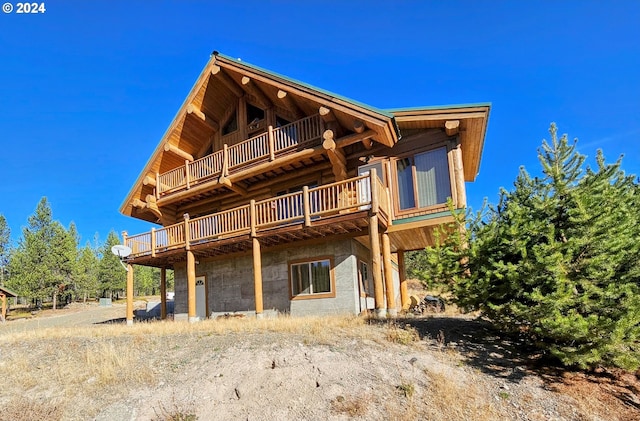 rear view of house with a balcony