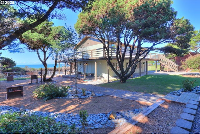 property view of water with a fire pit