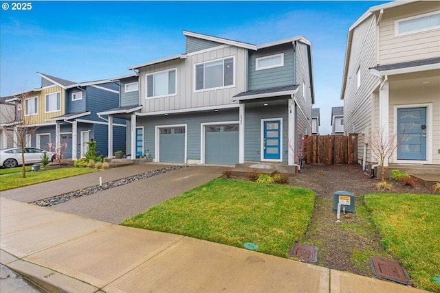 view of front of house with a front yard and a garage