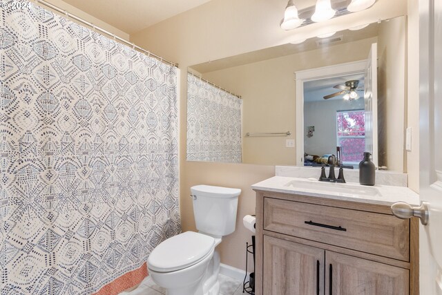 bathroom with vanity, walk in shower, toilet, and tile patterned floors