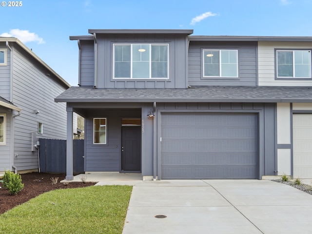 view of front of house featuring a garage and a front yard