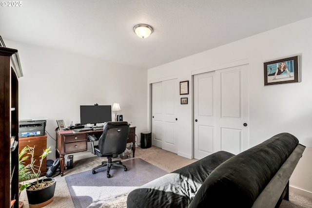 view of carpeted office space