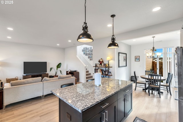 kitchen with light wood finished floors and recessed lighting