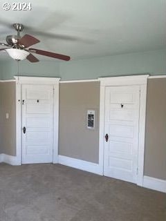 interior space featuring carpet floors and ceiling fan