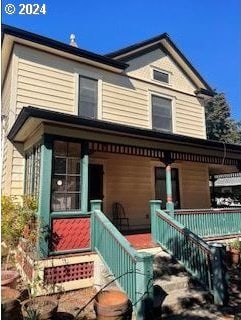 back of house with covered porch