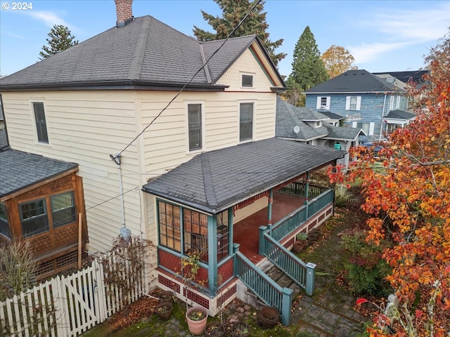 back of house featuring covered porch