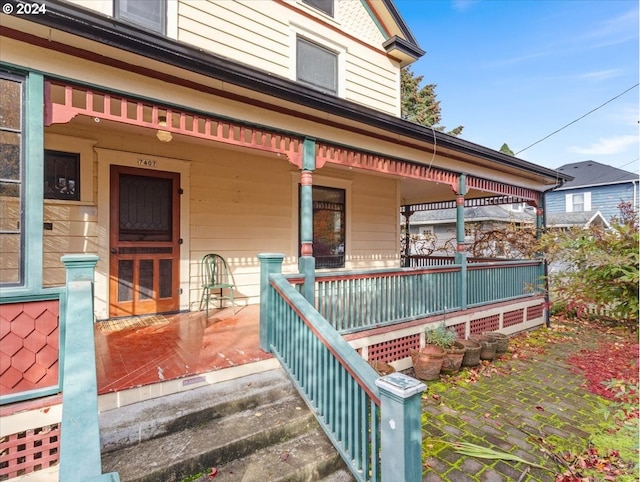 property entrance with covered porch