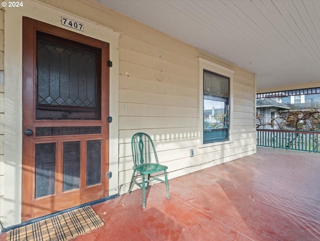 doorway to property featuring a porch