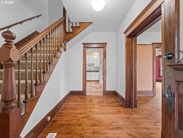 entrance foyer with light hardwood / wood-style floors