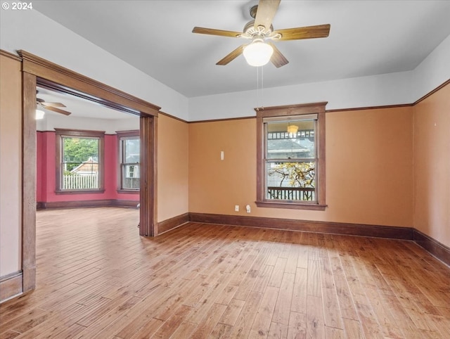 unfurnished room with light wood-type flooring and ceiling fan