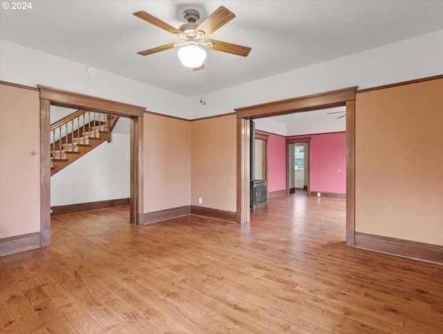 unfurnished room featuring ceiling fan and light wood-type flooring