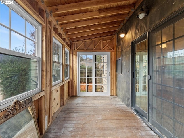 unfurnished sunroom with lofted ceiling and wood ceiling