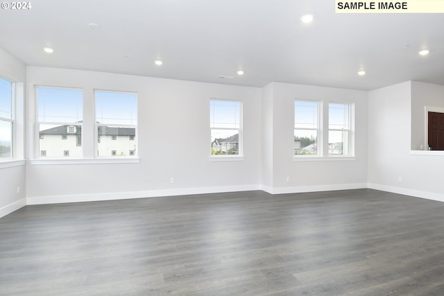 spare room featuring dark hardwood / wood-style floors