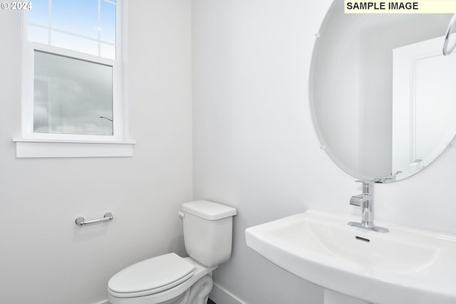 bathroom featuring sink and toilet