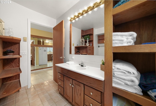 bathroom with vanity and tile patterned floors