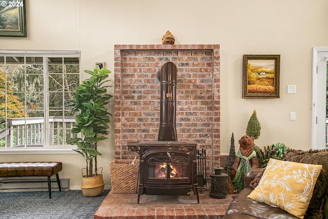 room details featuring a wood stove and baseboard heating