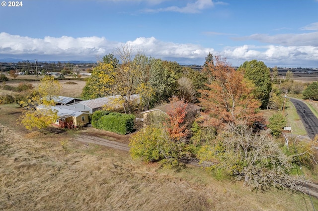 birds eye view of property with a rural view