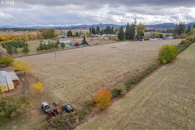 birds eye view of property with a rural view and a mountain view