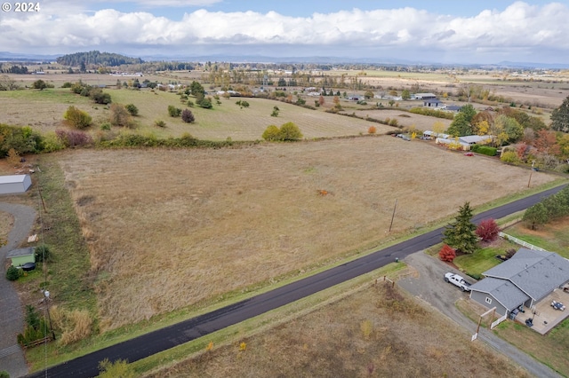 birds eye view of property featuring a rural view