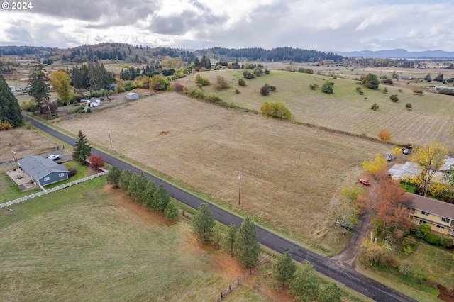 aerial view featuring a rural view and a mountain view