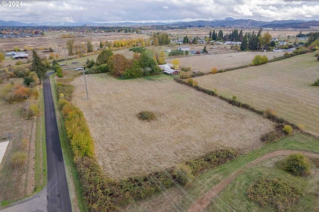 drone / aerial view with a mountain view and a rural view