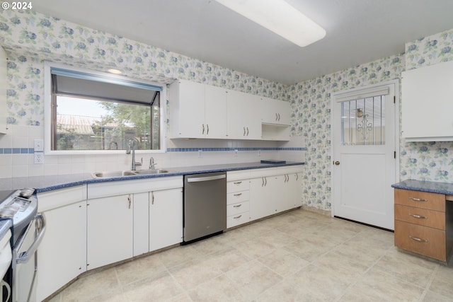 kitchen featuring sink, white cabinetry, stainless steel appliances, and light tile patterned flooring