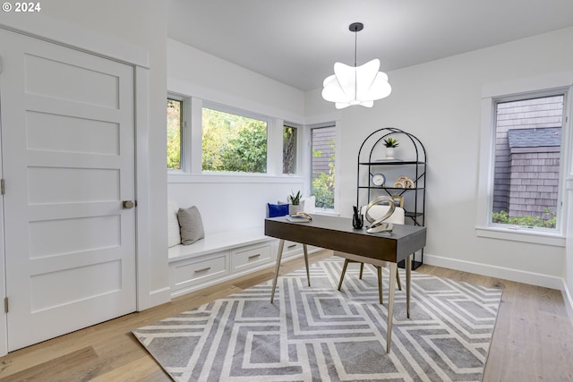 office featuring a chandelier and light hardwood / wood-style floors