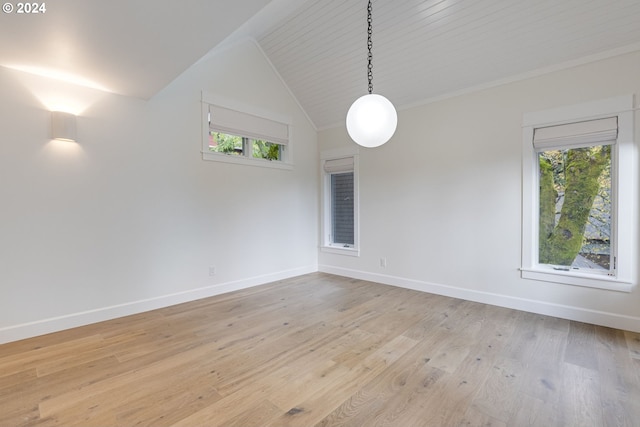 unfurnished room featuring vaulted ceiling, wooden ceiling, and light hardwood / wood-style floors