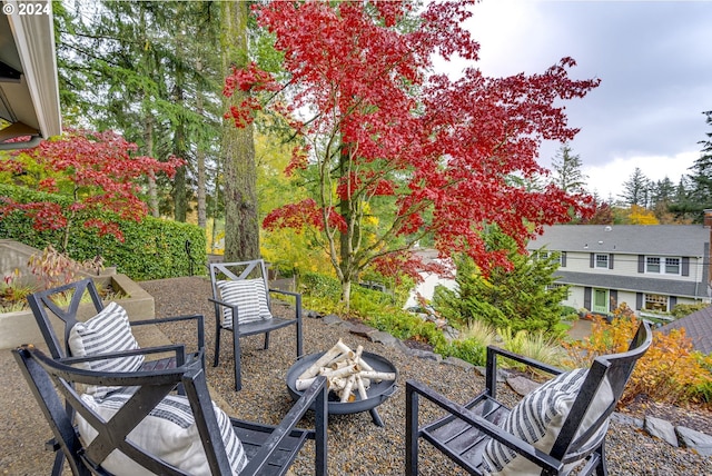 view of patio / terrace featuring an outdoor fire pit