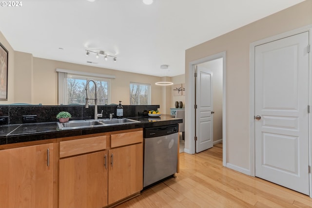 kitchen with tile countertops, baseboards, a sink, dishwasher, and light wood-type flooring